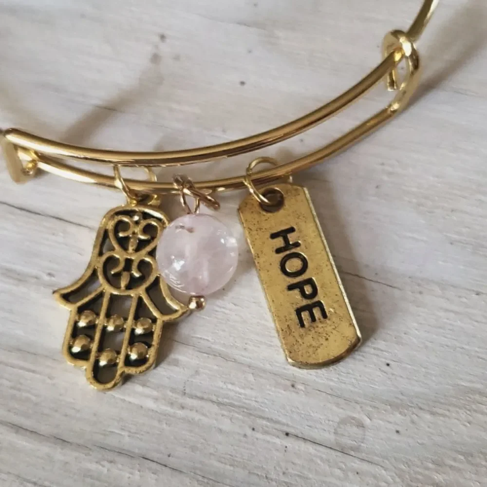 Bracelets by Sandra gold tone adjustable, Hope